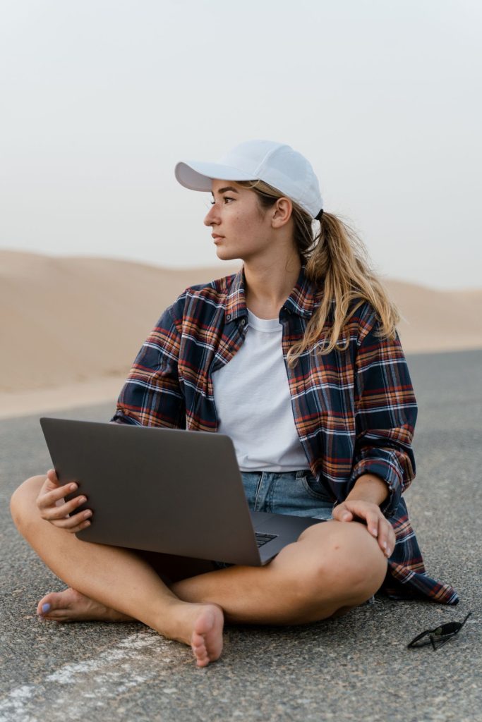 Digital nomad working on a laptop while traveling